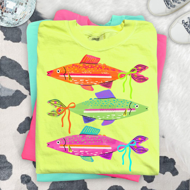 Bright Fish With Bows DTF Heat Transfer, colorful fish design with bows on pastel yellow t-shirt.