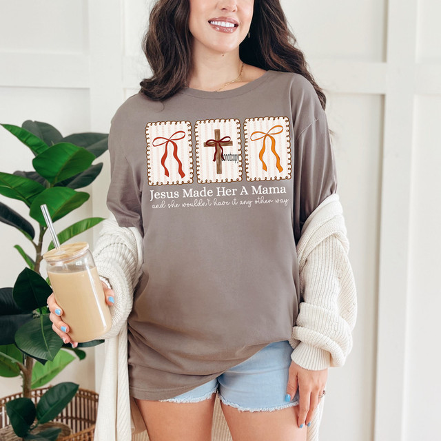Jesus Made Her A Mama Coquette DTF Heat Transfer, a woman wearing a T-shirt with a religious design and text, holding a jar of coffee.