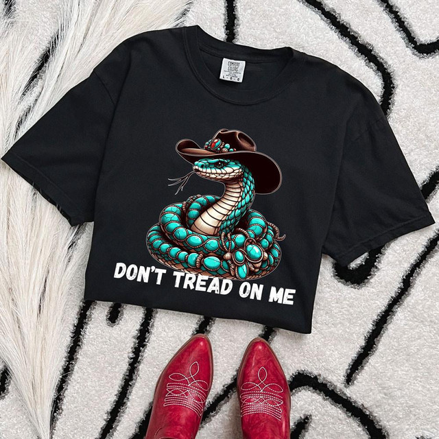Don't Tread On Me Snake White DTF Heat Transfer, black T-shirt featuring a coiled snake wearing a cowboy hat and the phrase 'Don't Tread On Me' printed underneath.
