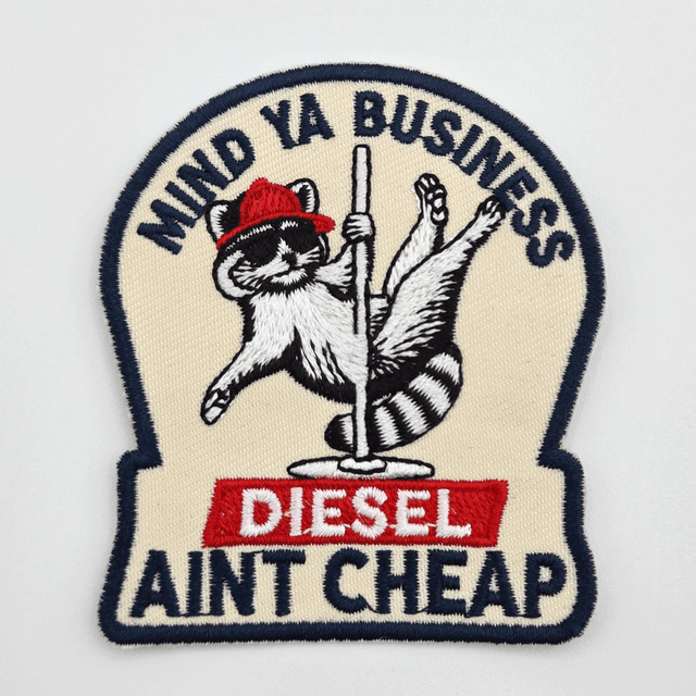 Mind Ya Business, Diesel Ain't Cheap Hat Patch – 2.5 x 3 inches, embroidered patch featuring a cat with a red hat holding a pole, with text "DIESEL" and "AINT CHEAP" on the patch.