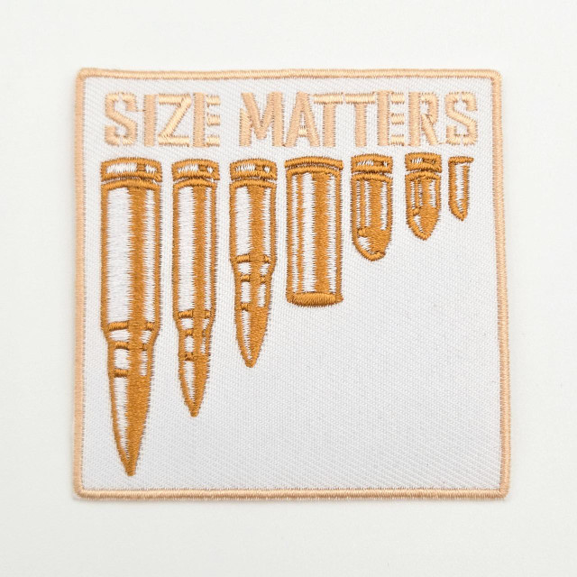 Size Matters Embroidered Hat Patch – 3 x 3 inches, close-up image of a patch with orange embroidery featuring the text 'Size Matters' and several pencil illustrations.