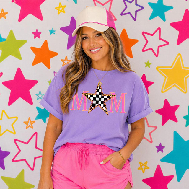Retro Mom Star DTF Heat Transfer, colorful star design on a purple T-shirt worn by a smiling woman against a starry background.