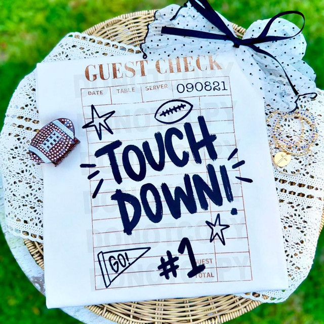 Guest Check Touchdown DTF Heat Transfer, football-themed heat transfer print on a paper guest check with handwritten style text and decorative doodles.