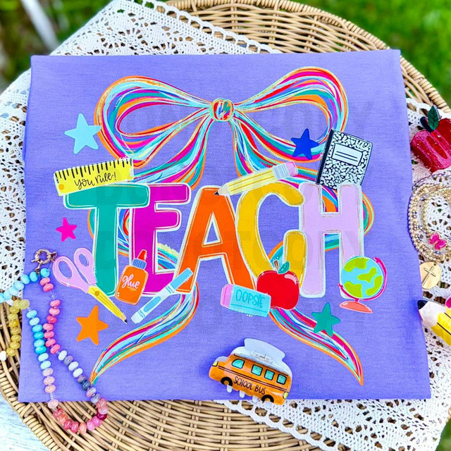 Retro Teach Rainbow Bow DTF Heat Transfer, colorful rainbow bow and educational school-themed design on purple fabric.