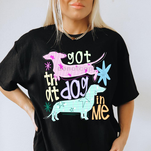 Got That Dog In Me DTF Heat Transfer, colorful dog-themed design on black T-shirt with playful text and star accents.