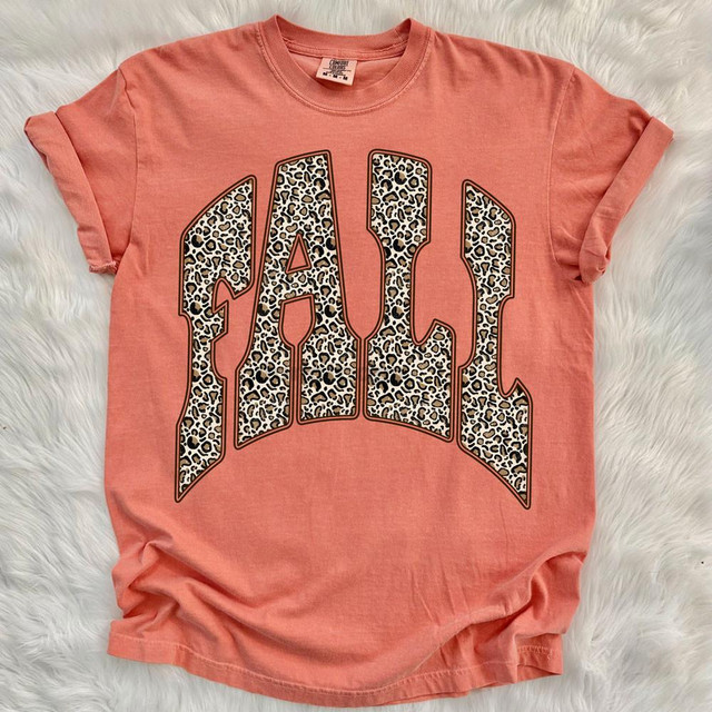 Leopard Fall DTF Heat Transfer, leopard print letter design on a peach-colored T-shirt.
