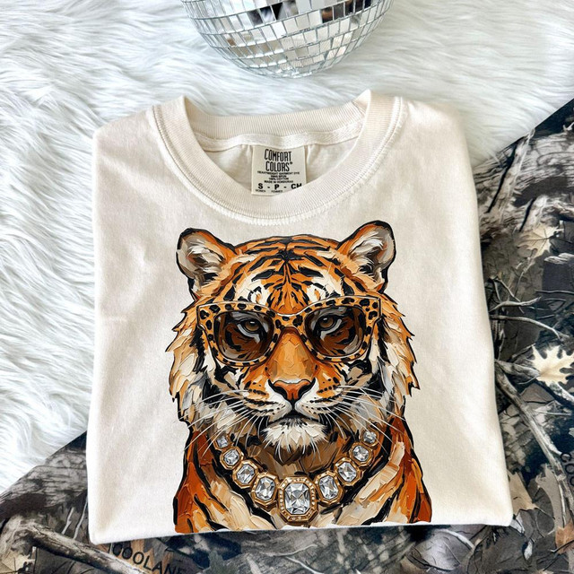 Glam Tiger DTF Heat Transfer, stylish t-shirt featuring a tiger wearing sunglasses and a diamond necklace.