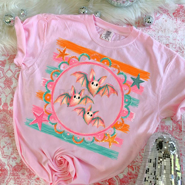 Retro Bats DTF Heat Transfer, colorful bat design with stars on pink t-shirt.