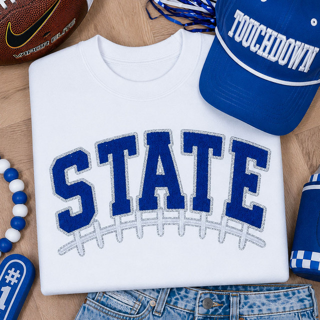 Royal blue State varsity chenille iron-on patch with embroidered football lace detail for football spirit wear, game day apparel, and boutique clothing.