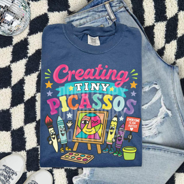 Creating Tiny Picassos DTF Heat Transfer, colorful kids' T-shirt with artistic cartoon characters and creative design.