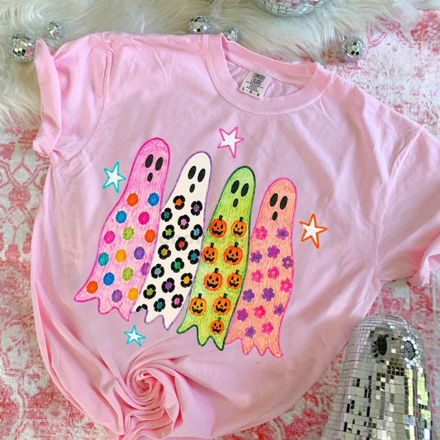 Retro Patterned Halloween Ghosts DTF Heat Transfer on pink T-shirt, featuring colorful ghost designs with polka dots, floral, and pumpkin patterns for Halloween decorations.