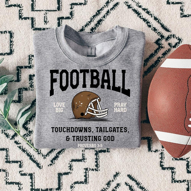 Football Love Big Pray Hard DTF Heat Transfer, gray T-shirt with football graphic, text and bible verse about football and faith.