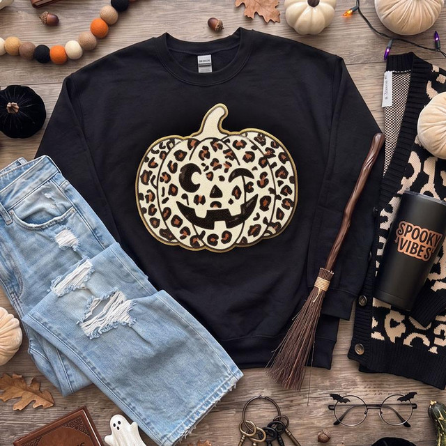 Leopard Jack-O-Lantern Sequin Patch, a Halloween pumpkin design with leopard print sequins on a black sweatshirt.