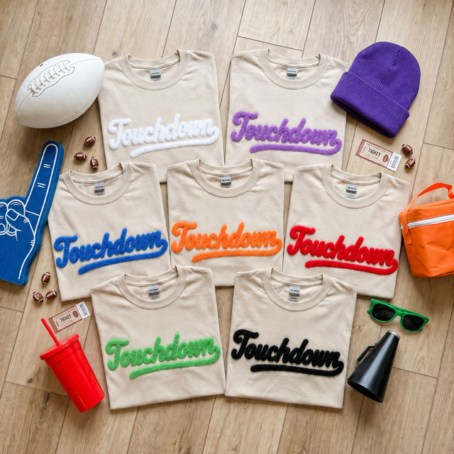 Touchdown chenille football shirt patches in multiple colors featuring fluffy retro script lettering for game day and spirit wear.