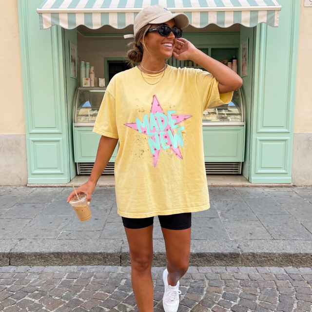 Made New DTF transfer with retro pink polka-dot star and aqua lettering on a mustard yellow t-shirt