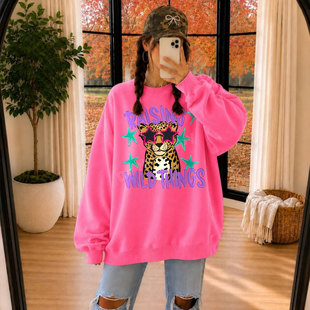 Raising Wild Things DTF transfer with cheetah cub wearing star sunglasses and teal star accents in purple lettering