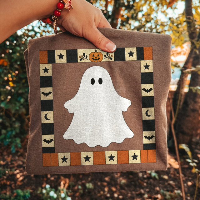 Vintage folk art ghost DTF transfer with checkered star, bat, moon, and pumpkin quilt-style border