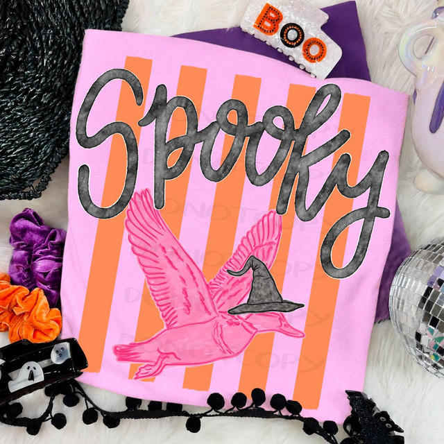 Spooky DTF transfer with pink flying duck wearing a witch hat over an orange and black striped background with black script lettering