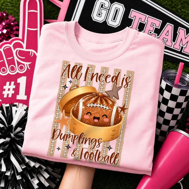 All I Need Is Dumplings & Football DTF Transfer, a cute game day design t-shirt featuring a smiling football in a lunchbox with stars and text, perfect for sports fans and football enthusiasts.