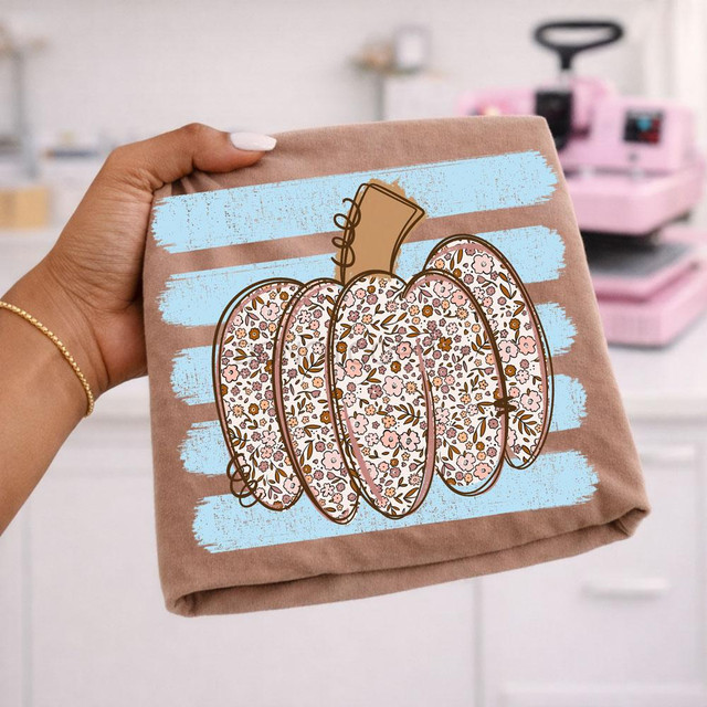 Floral Pumpkin Stripes DTF Transfer, pink floral pumpkin with blue stripes heat transfer design on beige fabric.
