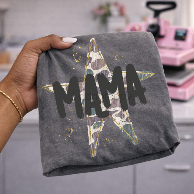 Mama Camo Star DTF Transfer, distressed camouflage star Mom heat transfer on gray fabric.