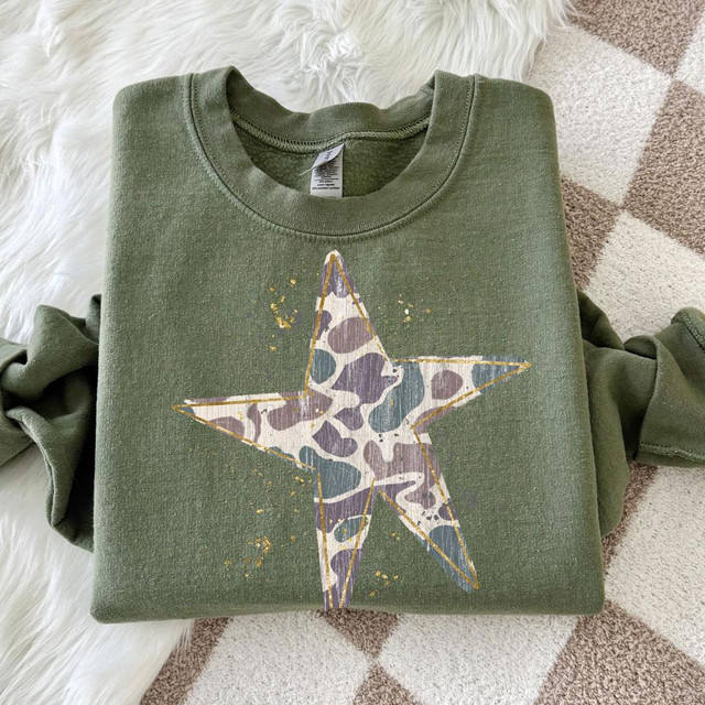 Camo Star DTF Transfer, distressed camouflage star graphic heat transfer on a green sweatshirt.