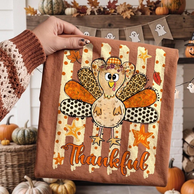 Thankful Turkey DTF Transfer, whimsical fall Thanksgiving design featuring a cute turkey with colorful patterned feathers and the word 'Thankful' written below.