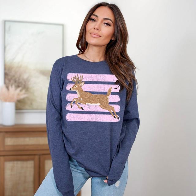 Leaping deer DTF transfer with distressed pink brush stripes on a heather navy long sleeve shirt