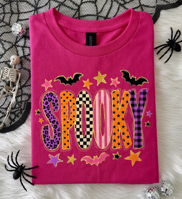 Spooky Halloween DTF transfer with multi-pattern letters in leopard, checkerboard, polka dot, stripe, stars, and plaid, surrounded by bats and stars