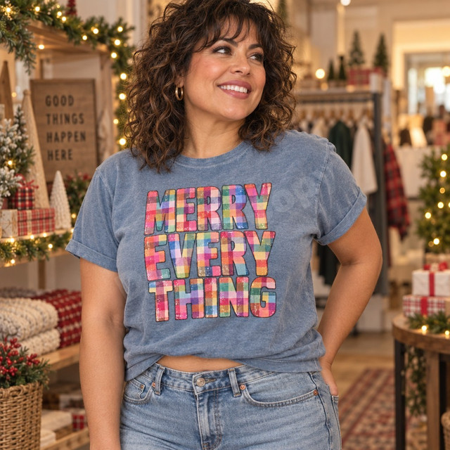 Merry Everything holiday DTF transfer in bold block letters filled with rainbow plaid patchwork pattern and distressed texture Shown on a Washed Denim t-shirt.
