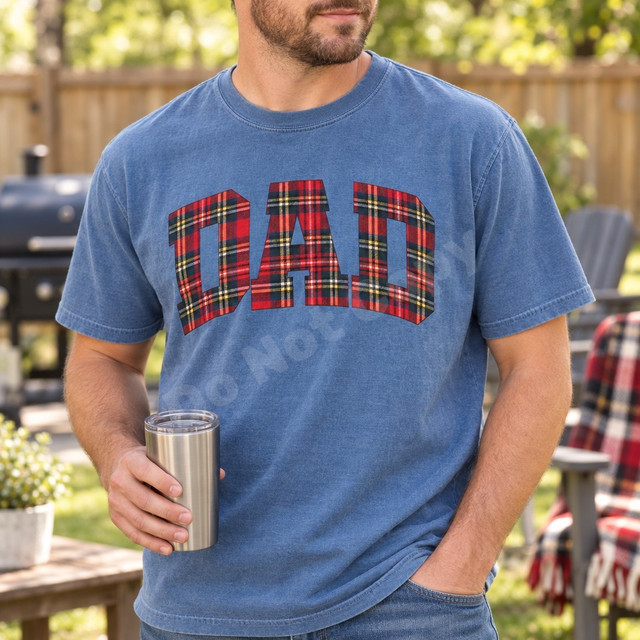 DAD DTF transfer in large arched collegiate block letters filled with red tartan plaid pattern on a blue t-shirt Shown on a Denim t-shirt.