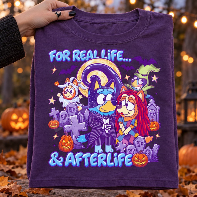 Halloween DTF transfer featuring cartoon dog characters dressed as Jack Skellington and Sally with ghost and witch puppies, moon, bats, pumpkins and tombstones, reading For Real Life and Afterlife Shown on a Grape t-shirt.