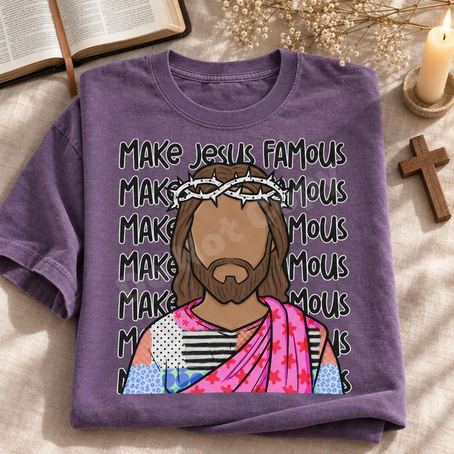 Make Jesus Famous DTF Transfer | Faceless Jesus Patchwork Robe Faith Design, colorful faceless Jesus illustration with a crown of thorns and patchwork robe over repeating “Make Jesus Famous” text, displayed on a folded purple T-shirt.