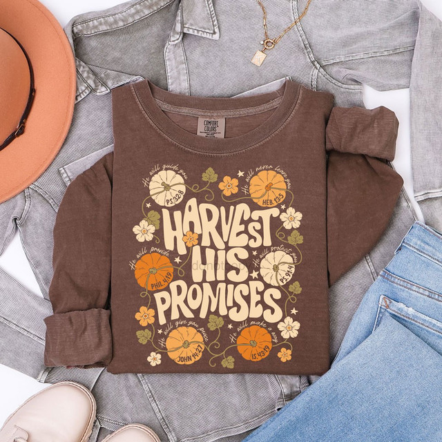 Harvest His Promises DTF transfer in retro script lettering with pumpkins, florals, and Bible verse references on an espresso brown shirt
