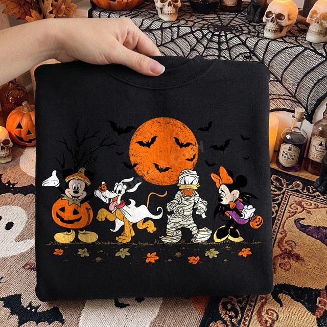 Halloween DTF transfer featuring cartoon mouse, dog, duck, and mouse characters in costumes trick-or-treating under a full orange moon with bats and fallen leaves