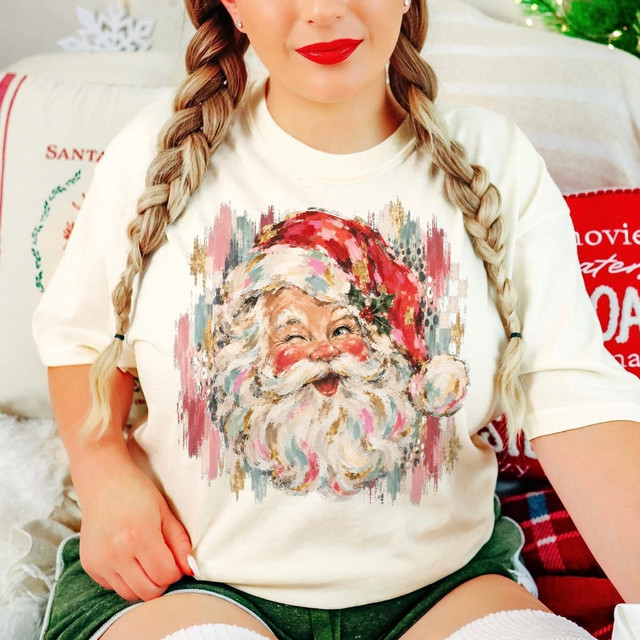 Winking Santa Claus face DTF transfer with hand-painted watercolor style and brushstroke accents in pink, teal, and gold