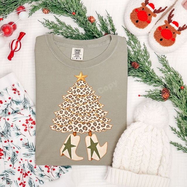 Leopard print Christmas tree DTF transfer with gold star topper and western cowgirl boots featuring star cutouts