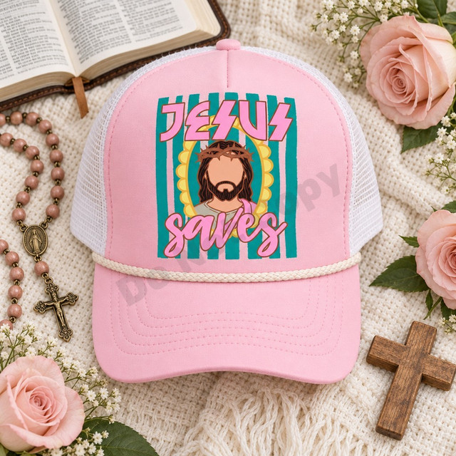 Jesus Saves DTF transfer featuring an illustrated portrait of Jesus with a crown of thorns in a yellow scalloped halo frame, pink graffiti lettering, and teal striped background, shown on a pink trucker hat Shown on a Pink foam front panel with ivory rope and white mesh back trucker hat.
