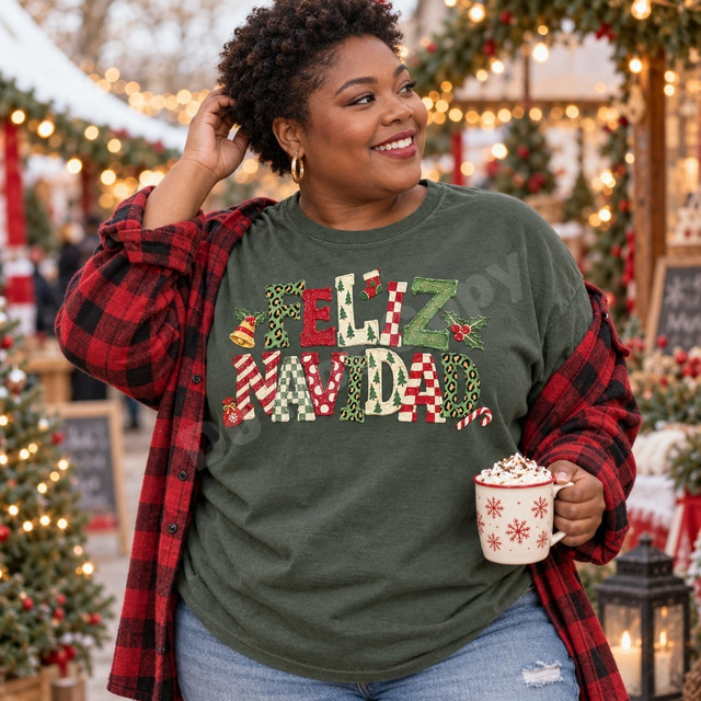 Feliz Navidad DTF transfer with oversized mixed-pattern lettering in leopard print, checkerboard, stripes, dots, and painted Christmas trees, accented by a gold bell, holly berries, a candy cane, and a snowman ornament Shown on a Moss t-shirt.