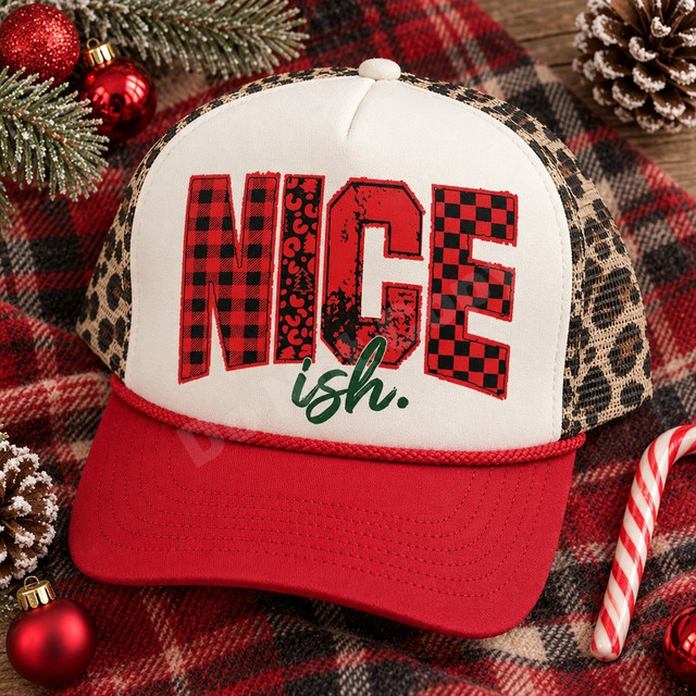Nice-ish Christmas DTF transfer with varsity-style red buffalo plaid, leopard, distressed, and checkerboard lettering and green brush-script ish. text Shown on a white foam front, red bill, leopard print mesh back trucker hat.