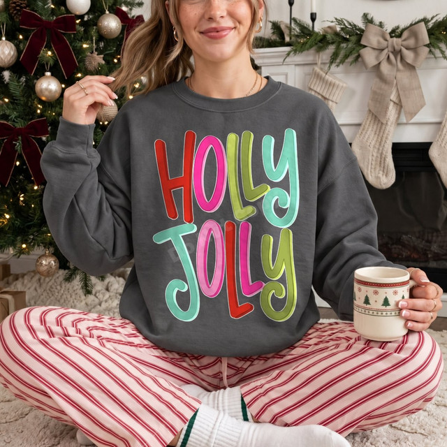 Holly Jolly DTF transfer in bold multicolor bubble lettering on a grey Christmas sweatshirt