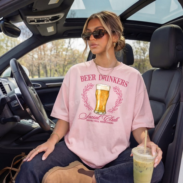 Beer Drinkers Social Club DTF transfer with illustrated beer glass, laurel wreath, and 'Drinks Well With Others' script lettering in pink and maroon