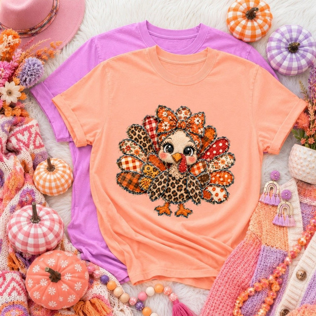 Cute patchwork-style turkey DTF transfer with floral bow headband and leopard, plaid, and gingham print feathers on an orange shirt
