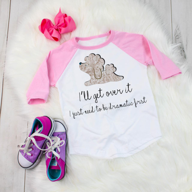 I'll Get Over It I Just Need To Be Dramatic First Poodle dog puppy sublimation transfer on a pink and white baseball tee, with pink sneakers and a pink scrunchie.