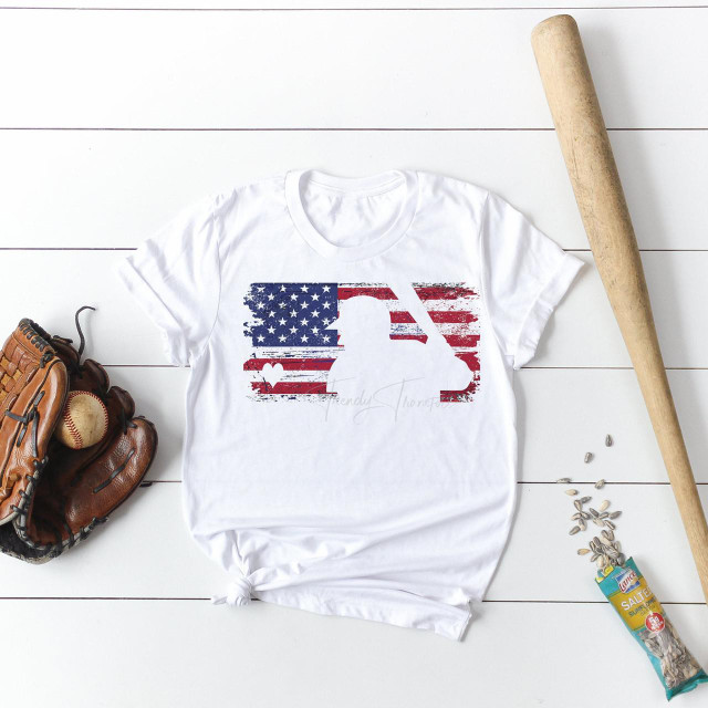 MLB Flag with Heart-Shaped Ball and Player Cutout Sublimation Transfer, displayed on a white T-shirt alongside a baseball glove, ball, baseball bat, and a bag of sunflower seeds.
