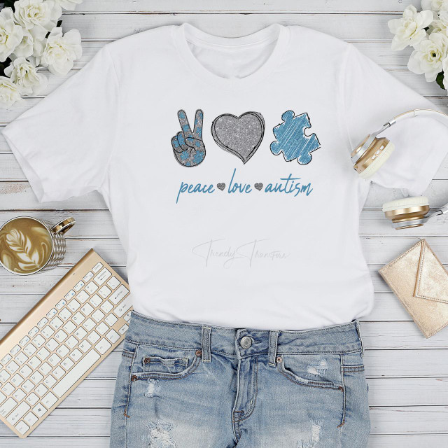 Peace Love Autism Puzzle Piece Heart Glitter Awareness Sublimation Transfer T-Shirt, white short sleeve t-shirt with peace, love, and autism puzzle piece heart graphic design.