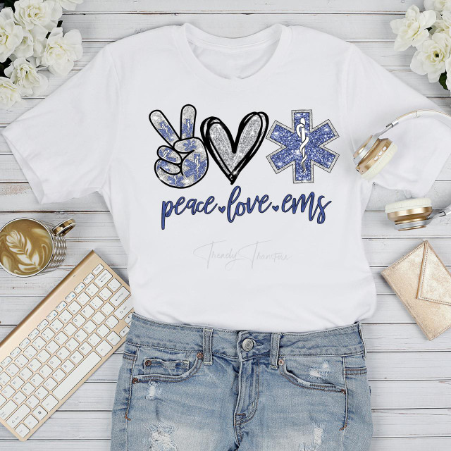 Peace Love EMS Glitter Heart Sublimation Transfer T-Shirt, white t-shirt with peace sign, heart, and medical star symbols in glittery blue and black design.