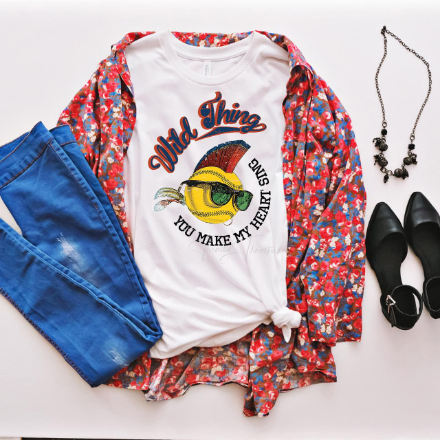 Wild thing you make my heart sing softball sublimation transfer, T-shirt design featuring a heart with a baseball, a mohawk, and sunglasses, with the phrase 'Wild Thing, You Make My Heart Sing'.
