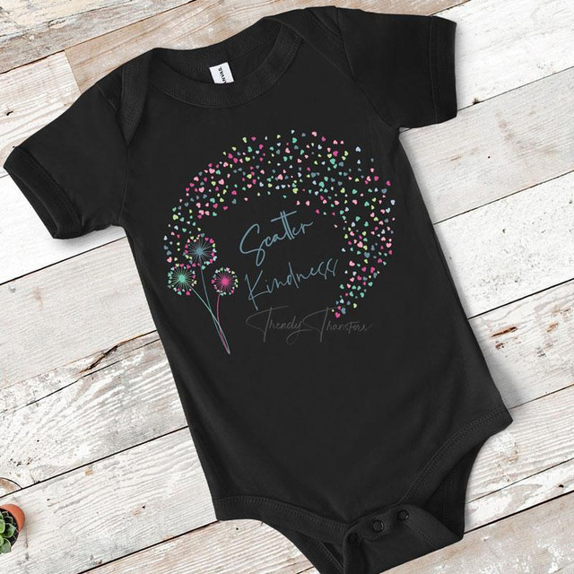 Scatter Kindness Hearts INFANT Screen Print Heat Transfer, black infant onesie with colorful heart-shaped flowers and handwritten-style text design.