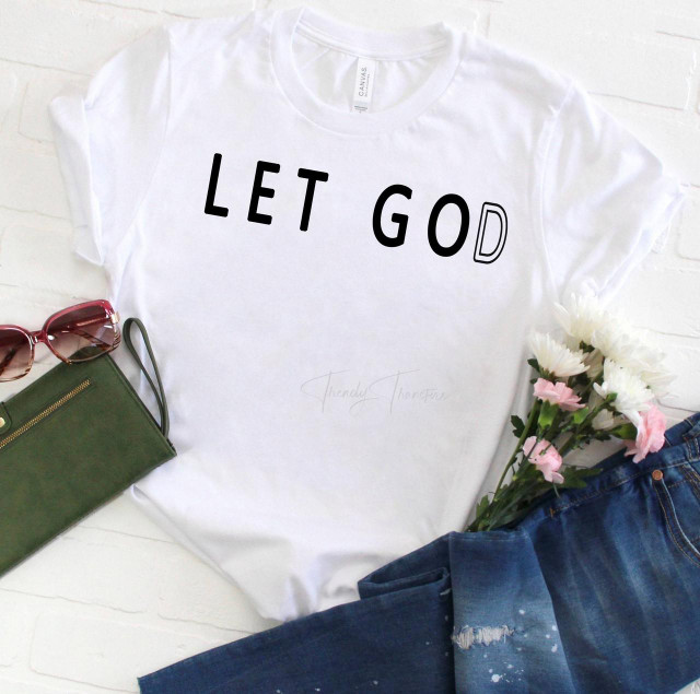 Let Go(d) Sublimation Transfer, white T-shirt with black and outlined text design.